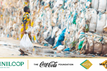 Women dressed in yellow carrying waste to a pile of waste